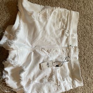 White ripped express shorts